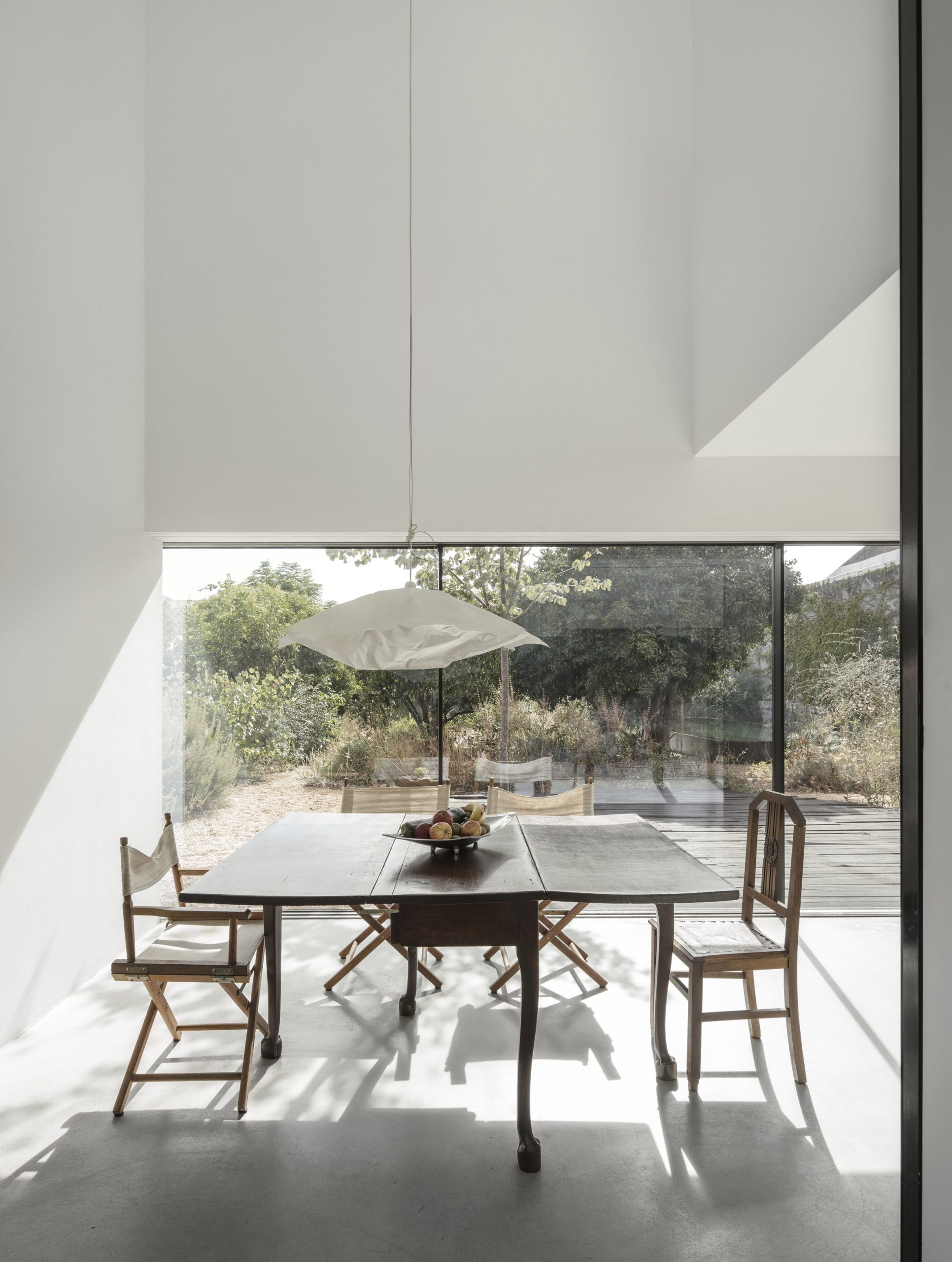 Mismatched seating inside Red House, Portugal, by Extrastudio