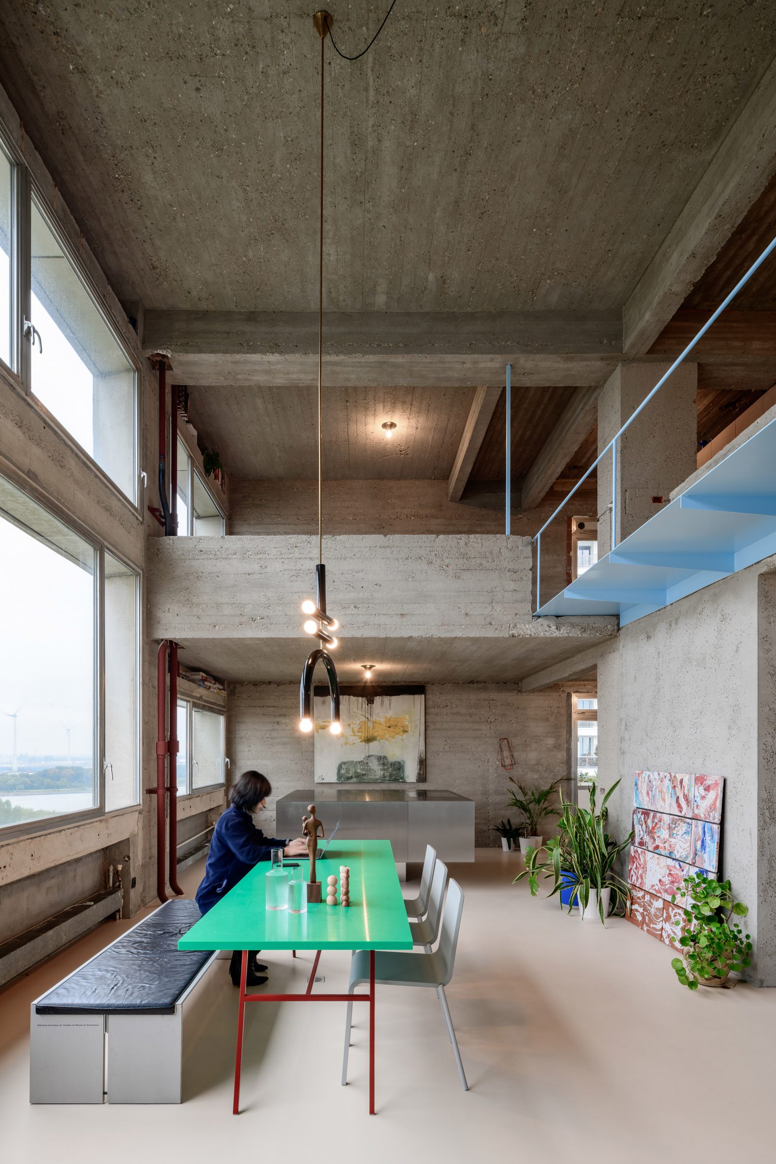 Dining room of Riverside Tower apartment by Studio Okami